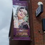 Full colour banner suspended from wall