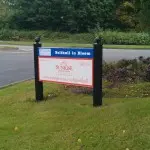 Square legged Post and Panel sign with finials