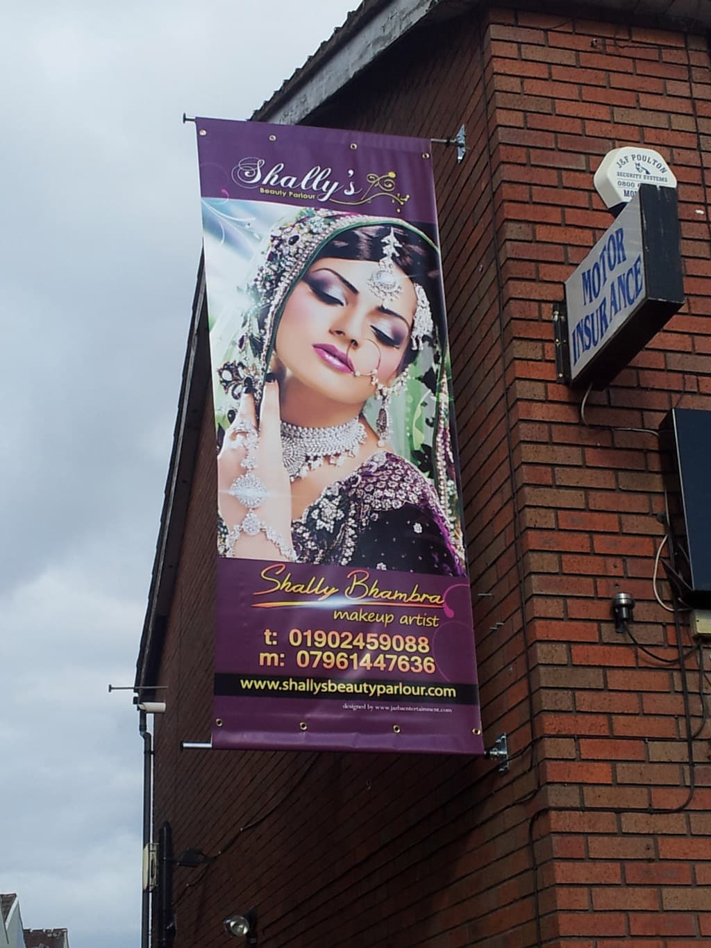Full colour banner suspended from wall